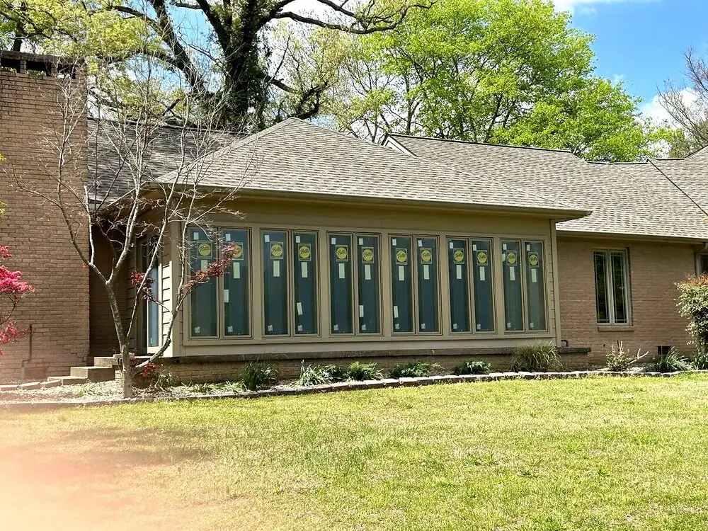 Sunroom addition with wall of windows