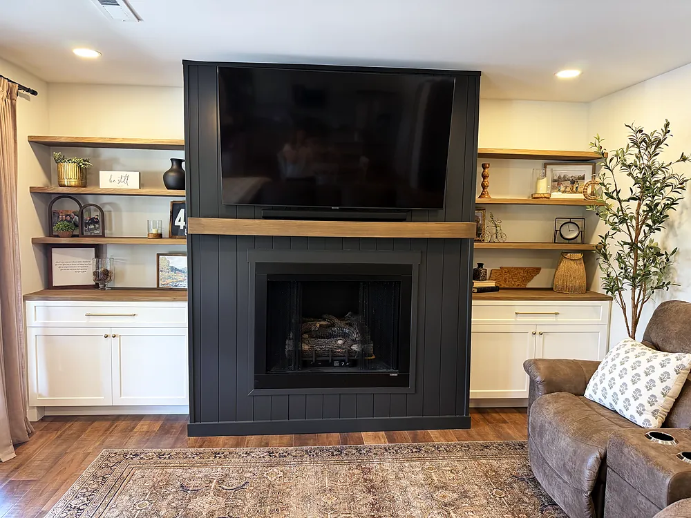 Custom built-in shelving and board-and-batten fireplace surround in a Murray KY living room